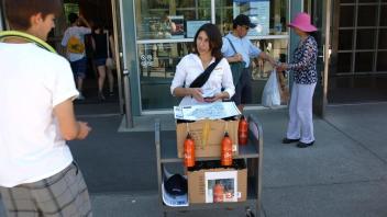 Handing out water bottles in front of Shields Library, 2012.jpg