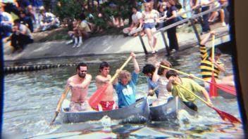 Picnic Day canoe races on Putah Creek, early 1980s.jpg